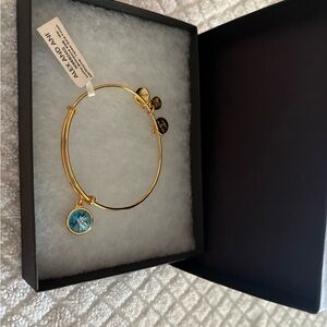 Alex and Ani Gold Bracelet with Blue Charm